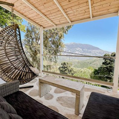 Private covered terrace with mountain views at Guesthouse 2