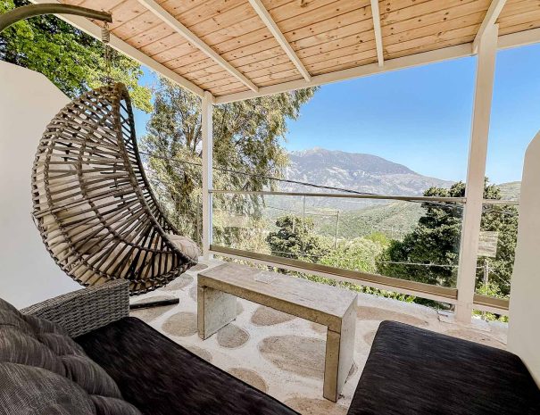 Private covered terrace with mountain views at Guesthouse 2
