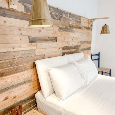 Double bedroom with rustic wooden details in Mountain Bliss Guesthouse 2