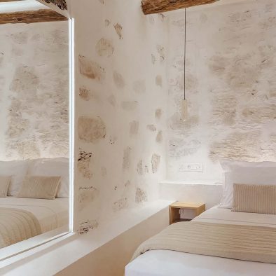 Traditional stone wall and bedroom detail in Guesthouse 3