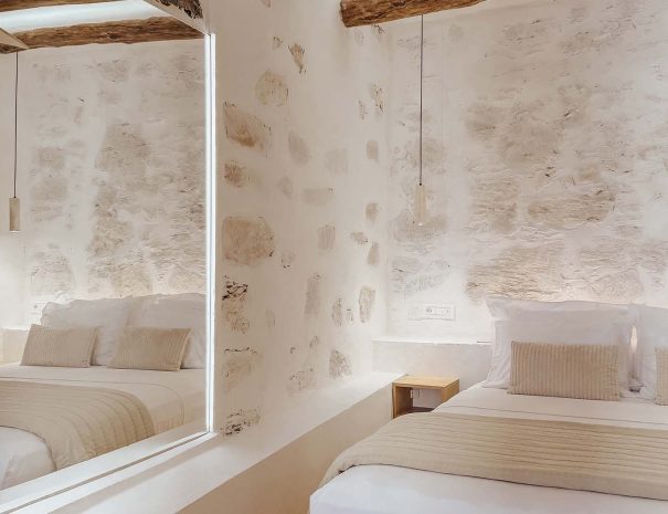 Traditional stone wall and bedroom detail in Guesthouse 3