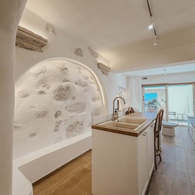 Stone interior and kitchen area in Mountain Bliss Guesthouse 3