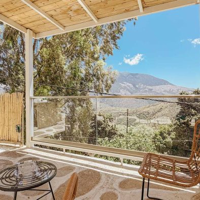 Private covered terrace with panoramic mountain views at Guesthouse 3